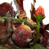 A close-up view of a detailed statue base with a flower and textured elements. Náhled obrázku produktu