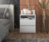A modern bedroom scene with a nightstand next to a bed, featuring decorative items. Produktbild-Vorschau