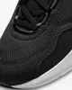 A close-up view of the toe box and laces of a black Nike shoe. Náhľad obrázku produktu