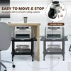 A black printer stand with two shelves is shown next to a desk, with a printer on top. Text overlays highlight features like "EASY TO MOVE & STOP" and "Lockable Design". Produktbild-Vorschau