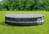 An Intex frame pool covered with a tarp, situated on a grassy lawn with trees in the background. Podgląd zdjęcia produktu