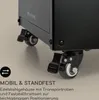 Close-up of the bottom of a black product, showing its wheels and a text overlay with a logo. Produktbild-Vorschau