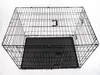 An empty black wire dog crate with a black plastic tray, shown from a top-down diagonal angle against a white background. Voir les images du produit