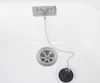 A close-up view of a sink drain with a stopper and chain. Produktbild-Vorschau
