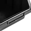 A close-up view of the edge and handle of a black plastic storage box. Anteprima dell’immagine prodotto