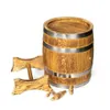 A wooden barrel with metal bands, resting on a wooden stand, with two wooden spigots and a stopper nearby. Produktbild-Vorschau