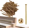 A pile of gold-colored screws and some wooden planks. Produktbild-Vorschau