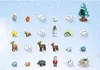 A collection of small, festive figurines and accessories arranged on a light blue, snowy background. Podgląd zdjęcia produktu