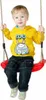 A young child is sitting on a red swing. Anteprima dell’immagine prodotto