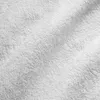 Close-up, top-down view of a white terry cloth towel, showing its textured surface with soft folds and creases. The lighting highlights the fluffy fibers and creates subtle shadows. Náhled obrázku produktu
