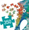 A close-up view of a partially assembled jigsaw puzzle with several loose pieces scattered around. A large teal puzzle piece with the number '350' is prominently displayed in the foreground. Voir les images du produit