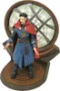 A Doctor Strange action figure standing on a circular base with a mystical portal in the background. Náhľad obrázku produktu