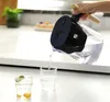 A hand is pouring filtered water from a pitcher into a glass, with another glass of water with fruit in the foreground. Náhľad obrázku produktu