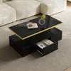 A modern living room scene with a black coffee table in the foreground, placed on a gray rug next to a cream-colored sectional sofa. Voir les images du produit