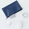 A blue organizer pouch with some electronic accessories laid out on a white surface. Anteprima dell’immagine prodotto