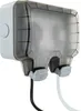 A close-up, studio shot of a white and gray outdoor electrical outlet box with a transparent gray cover, showing two cables plugged in. Anteprima dell’immagine prodotto