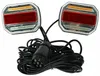 A pair of LED trailer lights with a connecting cable and plug, displayed against a white background. Náhled obrázku produktu