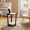 A round side table with a laptop and books in a living room setting. Produktbild-Vorschau