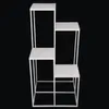 A white multi-tiered plant stand against a black background. Anteprima dell’immagine prodotto