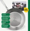 A close-up view of a stainless steel frying pan with a honeycomb pattern on the bottom, accompanied by marketing text highlighting its features and a warranty. Produktbild-Vorschau