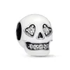 A white skull charm with clear crystal accents. Produktbild-Vorschau