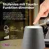 A hand is touching a dimmable LED lamp on a table. Anteprima dell’immagine prodotto