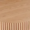 A close-up view of a wooden table with a slatted base. Produktbild-Vorschau