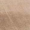 A close-up, textured view of a beige carpet. Podgląd zdjęcia produktu