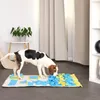 A dog is playing with a snuffle mat on the floor. Produktbild-Vorschau