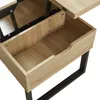 Close-up view of the interior of a lift-top coffee table with a wooden finish and black metal legs. Voir les images du produit