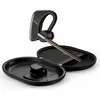 A black Bluetooth headset with gold accents is shown resting in its open black charging case against a white background. Produktbild-Vorschau