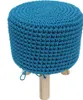 A blue crocheted pouf with wooden legs against a white background. Náhled obrázku produktu