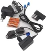 A collection of electronic accessories, including power adapters, batteries, and cables, arranged on a white background. Voir les images du produit