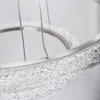 Close-up of a modern chandelier with crystal elements and metal frame. Anteprima dell’immagine prodotto