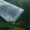 A transparent tarp is shown in the rain, with water droplets falling on it and dripping off the edge. Anteprima dell’immagine prodotto