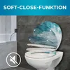 A toilet seat with a turquoise wave pattern is shown in a bathroom setting, with the lid in a partially open position. Produktbild-Vorschau