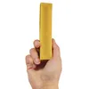 A hand holding a yellow chew toy. Produktbild-Vorschau