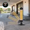 An outdoor patio with a heater and furniture. Anteprima dell’immagine prodotto
