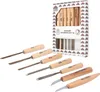 A set of wood carving chisels and knives are displayed in front of their packaging. Produktbild-Vorschau