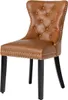 A single brown Chesterfield chair with black legs against a white background. Produktbild-Vorschau