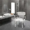 A bathroom with a sink, mirror, bathtub, and a shower chair. Náhled obrázku produktu