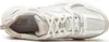 A top-down view of a white and beige New Balance running shoe. Produktbild-Vorschau