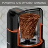 A cutaway view of a coffee grinder showing the grinding mechanism and ground coffee. Náhled obrázku produktu