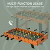 A foosball table is shown in two configurations: one on its legs and another with the legs removed, suggesting multi-functionality. Voir les images du produit