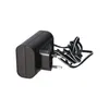 A black power adapter with a coiled cord and European-style plug, isolated on a white background. Produktbild-Vorschau