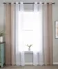 A window with curtains and a small plant on the windowsill. Produktbild-Vorschau