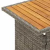 Close-up of the corner of a table, showing the woven rattan base and the wooden top. Anteprima dell’immagine prodotto