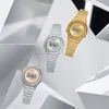 Three Casio vintage-style digital watches are arranged diagonally on a white and gray geometric background. Produktbild-Vorschau