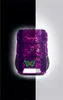A purple backpack with pink heart patterns and a green butterfly graphic, shown against a split black and white background. Voir les images du produit
