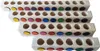 Four wooden blocks with circular indentations, each containing colored discs. The blocks are arranged diagonally, with the largest at the top and the smallest at the bottom. Produktbild-Vorschau
